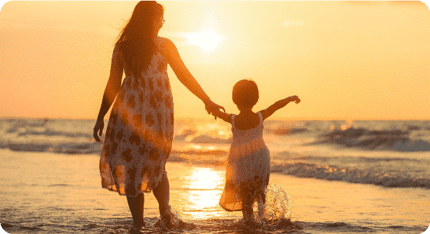 A woman and a child on a beach